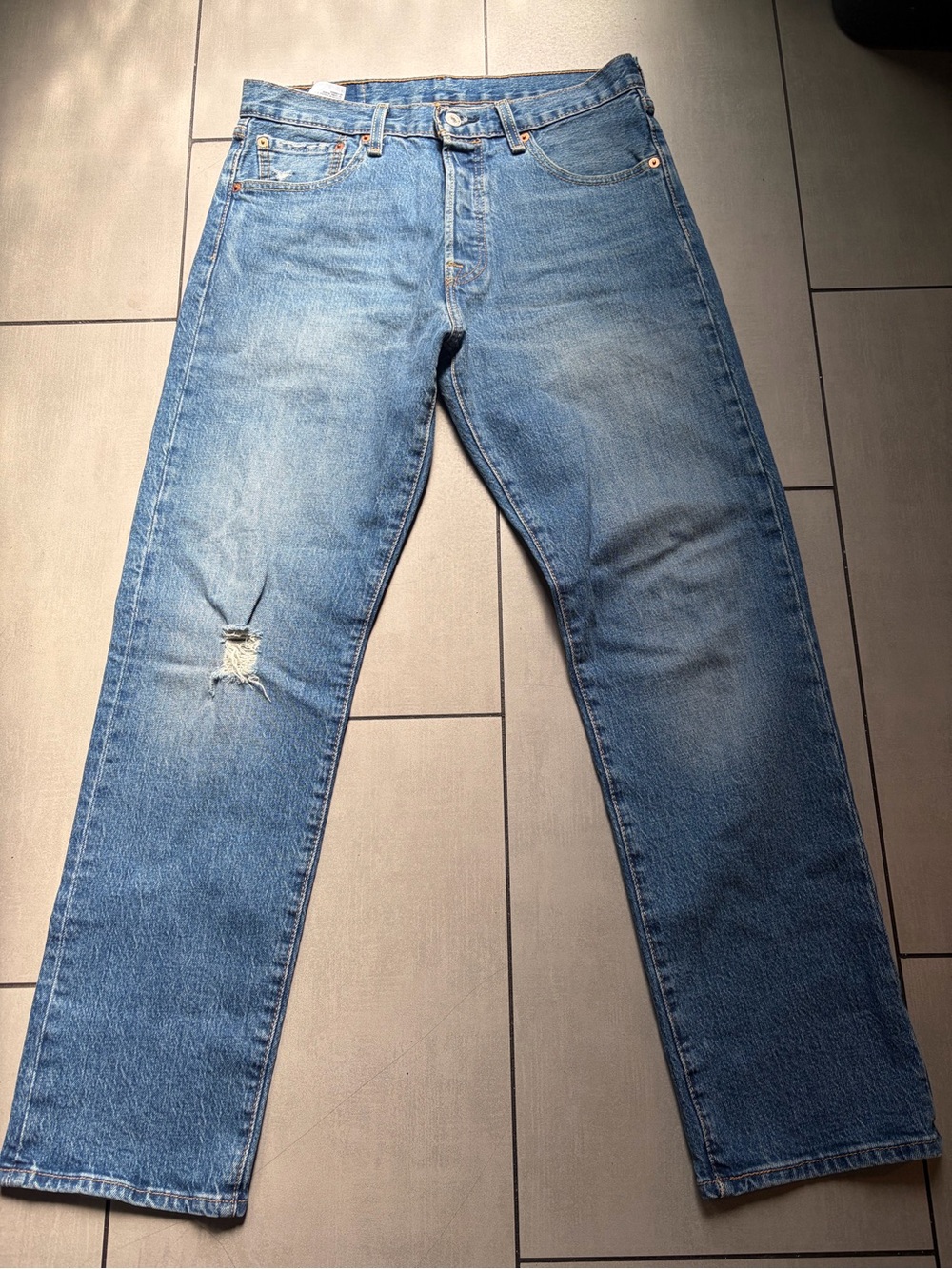 Levi's Men's Straight Jeans in Light Blue Denim with Distressed Knee